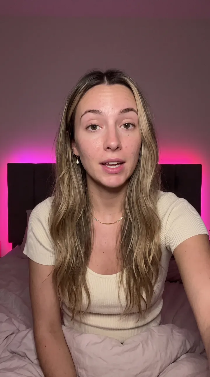 Lifestyle AI UGC ad still: Late night bed talk. LED glow behind, close and candid.