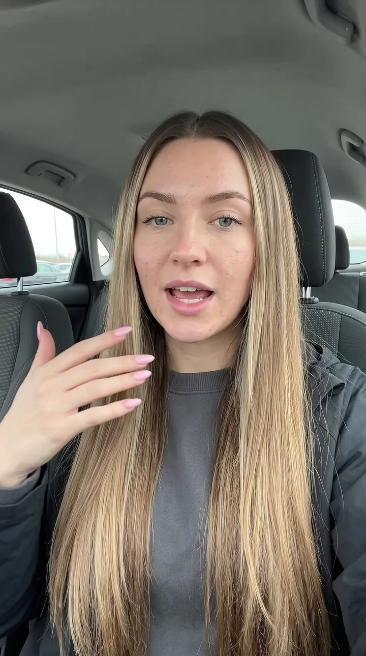 Reaction AI UGC ad still: Car storytime. Mid-story, hands going.