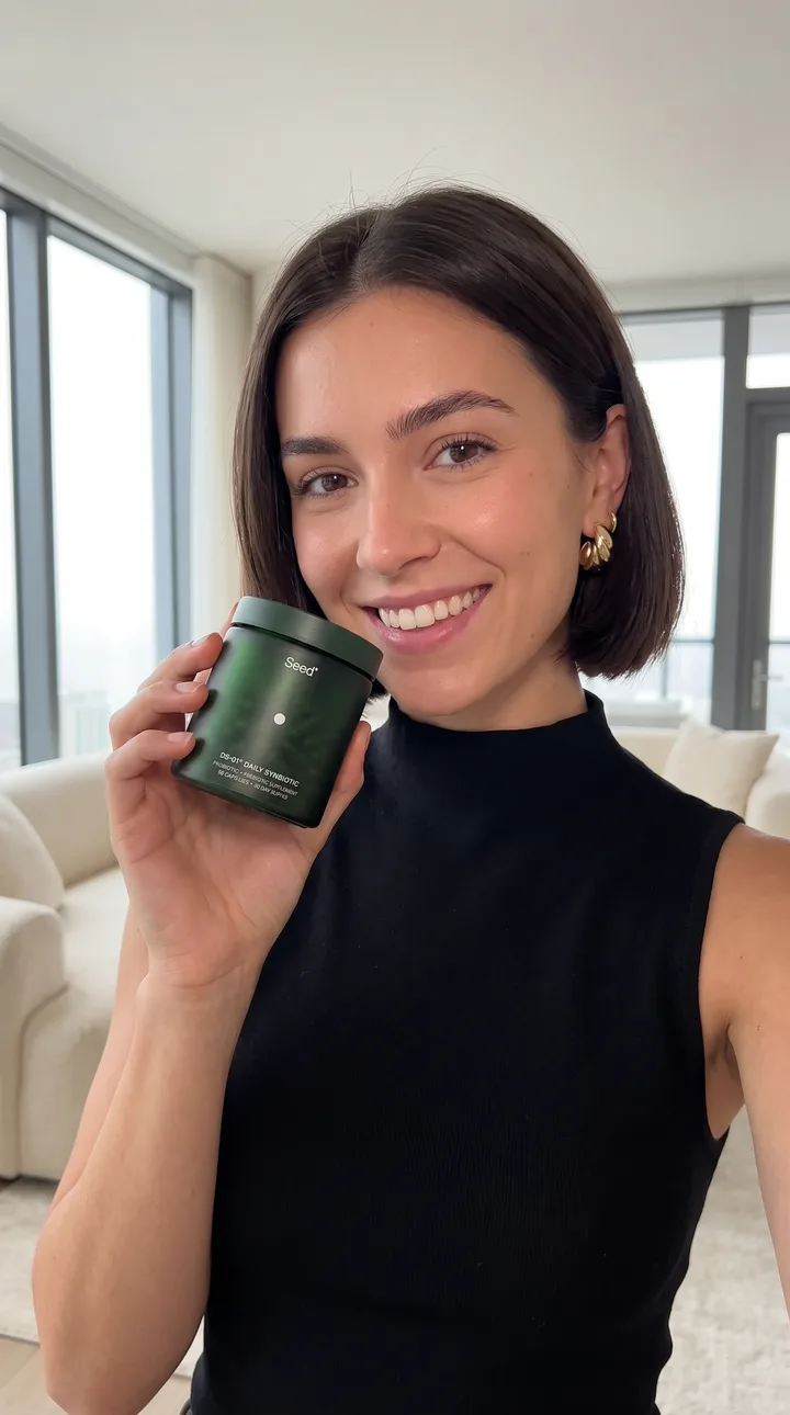 Beauty AI UGC ad still: Fragrance close-up. Window light, bottle beside the face.