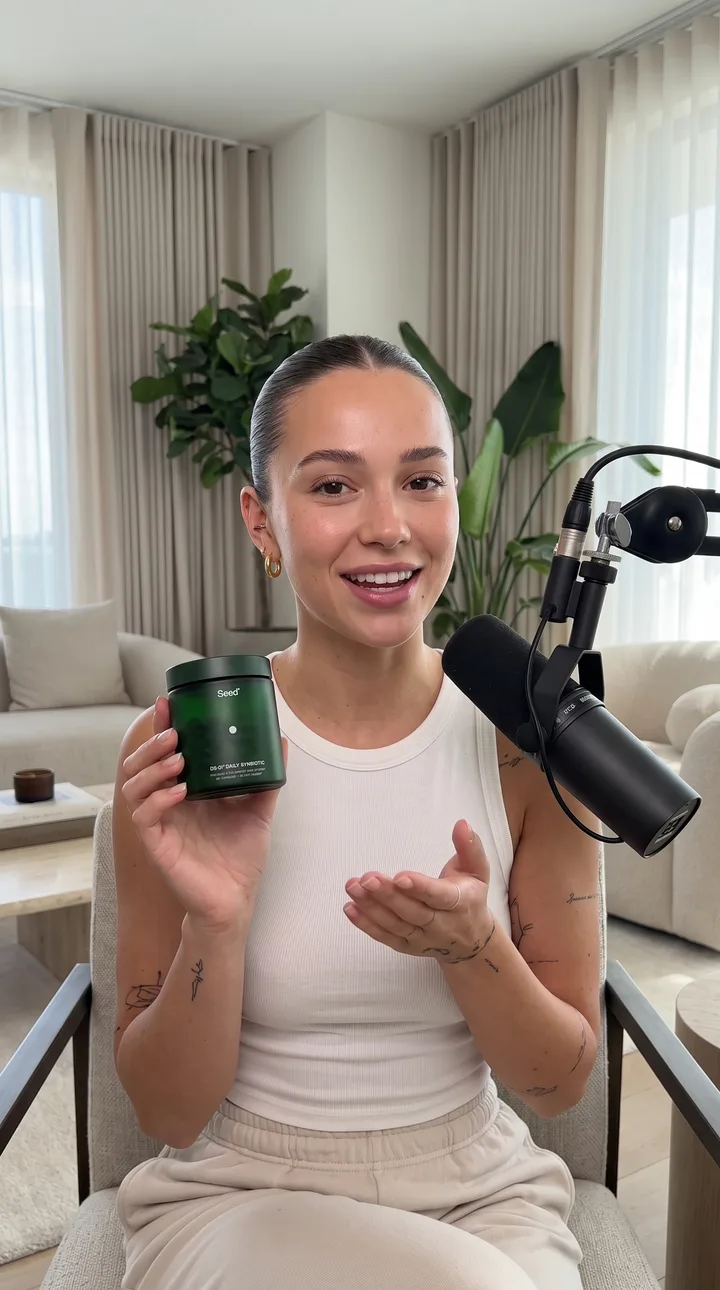 Podcast AI UGC ad still: Podcast recommendation. Sofa, boom arm, easy conversation.