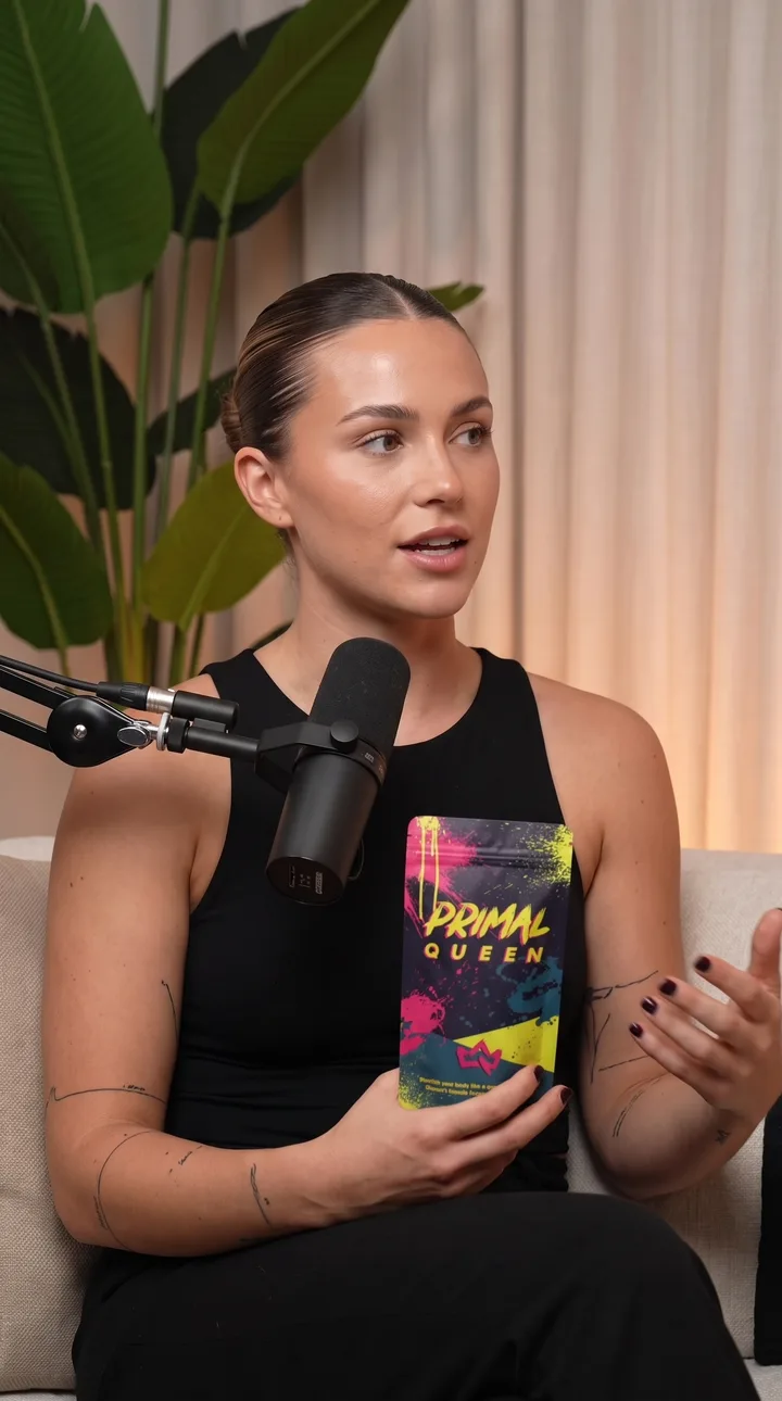 Podcast AI UGC ad still: Podcast product pickup. Mic in shot, product raised mid-point.